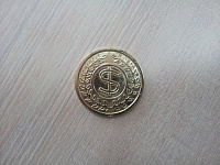 Монета золотой Доллар
